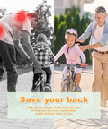 Parent guiding child with kids bicycle safety trainer push bar handle for balance and confidence helps little riders, gray