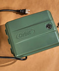 Four Station Outdoor Sprinkler Timer With Swing Panel For Lawn Care, shown with power cord, screws, and weatherproof cabinet