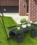 Heavy Duty Metal Deck Garden Cart With 10 Inch Air Tires For Farm Yard And Cargo Large 34 Inch By 18 Inch Utility Wagon With 176 Lb Capacity Great For Dirt Rocks Wood Boxes And More Green, on grass with plants