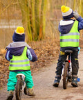 Kids in fluorescent green safety vests biking outdoors with Kids High Visibility Safety Vests Bulk Pack Of 10 Neon Reflective Traffic Vests