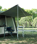 Bug Proof Camping Screen Tent With Mosquito Netting, Spacious 11.8 By 6.6 By 6.2 Ft Interior, Fits 4 To 6 People, Includes 6 Windropes And 12 Stakes, Portable Screen House For Hammock, Beach, Picnics, Parties, And Backyard Fun set up in a backyard with a chair and table