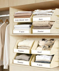 5 Tier Closet Organizer With Weekly Labels And Stackable Bins Metal Frame Shelf Foldable Cube Bins Kid Friendly Home Storage Baskets For Kids And Adults Beige with labeled bins holding shirts and sweaters.