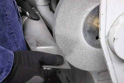 Worker using EXL PRO Deburring Wheel For Metal Finishing And Polishing, Unitized 6 In X 1 In X 1 In for smoothing metal edges