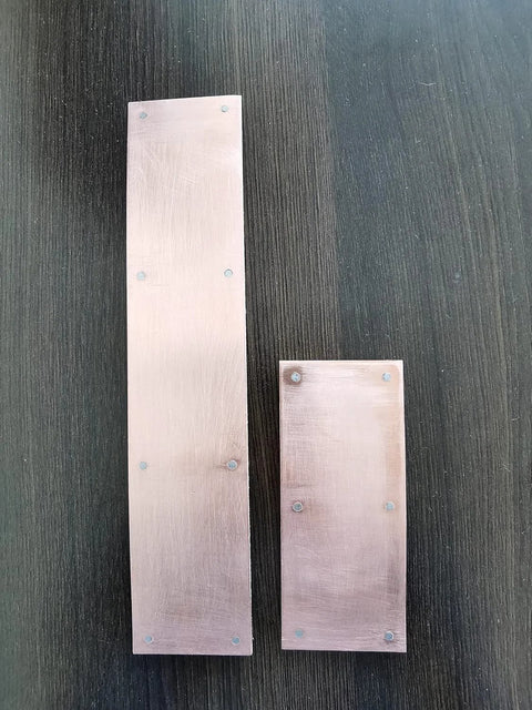 Magnetic copper spoon backer showing two 5-inch copper panels on a dark surface.