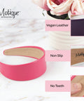 Slay Your Daily Hair Game With This Super Comfy Two Inch White Vegan Leather Headband For Women Featuring Nonslip Inner Lining To Stay Secure During Gym Workouts Or Lazy Sundays And Weekends. Pink vegan leather headband close-up.