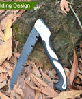 Go-To Folding Hand Saw 12 Inch for tree trimming and pruning with high manganese steel teeth on ground by leaves