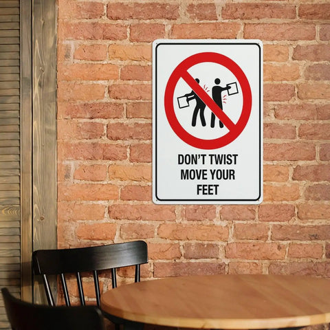 Dont Twist Move Your Feet Safety Instruction Sign 8x12 Aluminum on brick wall near table and chair