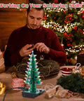 Man assembling 3D Christmas Tree Soldering Kit With LED Flashing Lights In 7 Colors Dope DIY Electronics Project For Learning STEM