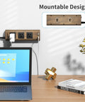 Mounted power strip surge protector with USB-C and USB-A, 1800J surge protection, wood finish on wall above desk, laptop shown.