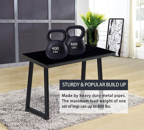 36 Inch Metal Table Bar Legs Heavy Duty Beefy Industrial Style With Adjustable Feet Pads Trapezoid Design For Sturdy Home Bar Counters And Workbenches Supports Up To 800 Lbs Per Set shown with kettlebells on a table.