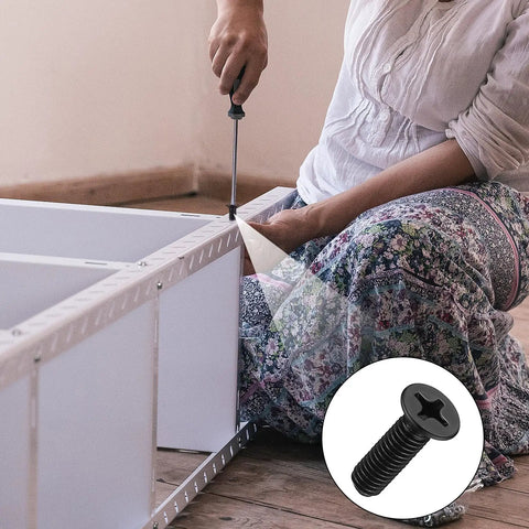 Person assembling furniture using M2 To M5 Screws And Nuts Kit With Washers Black Phillips Countersunk Flathead.