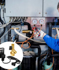 Technician installing two sets air compressor electronic drain valve kit with braided steel hose and brass fittings.
