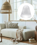 Heavy Duty Thirty Two Piece Cone Shaped Clear Rubber Bumpers With Powerful Self Adhesive Backing For Household Furniture on a sofa.