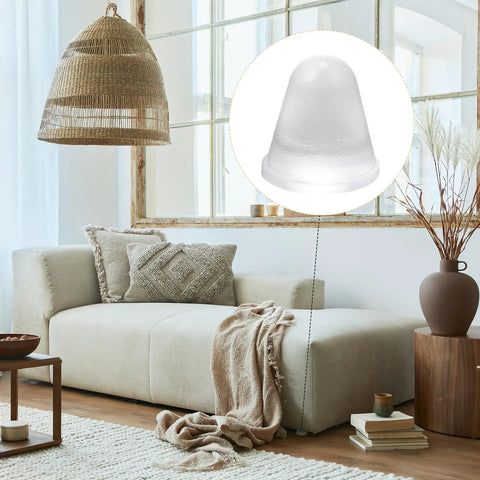 Heavy Duty Thirty Two Piece Cone Shaped Clear Rubber Bumpers With Powerful Self Adhesive Backing For Household Furniture on a sofa.