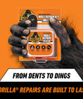 Heavy Duty Wall Repair Kit With Spackling And Primer 8 Oz Tub For Patching Small And Large Holes In Walls And Ceilings packaging held by gorilla hand