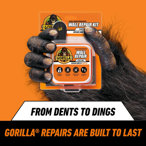 Heavy Duty Wall Repair Kit With Spackling And Primer 8 Oz Tub For Patching Small And Large Holes In Walls And Ceilings packaging held by gorilla hand