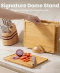 Heavy Duty 3 Piece Bamboo Cutting Board Set With Wooden Stand For Everyday Kitchen Tasks Built Different With Top Shelf Non Toxic Grain And Straight Up Durable Construction Every Home Cook Gonna Love, cutting boards in use on countertop.