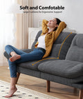 Woman reclining on 66 Inch Corduroy Futon Sofa Bed With Adjustable Backrest And Armrests, in grey, showcasing comfort in small living spaces.