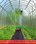 Greenhouse interior with Heavy Duty 3 Ft By 250 Ft Weed Blocker Landscape Fabric for weed blocking and ground cover in beds.
