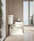 Hyten 3 Inch Elevated Soft Close Round Toilet Seat Biscuit Finish in modern bathroom setting, showing raised height and comfort grip.