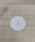 Circular white furniture slider with Calfshion text, designed for heavy duty furniture moving on various floor types.