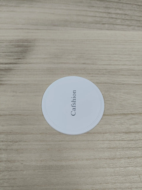 Circular white furniture slider with Calfshion text, designed for heavy duty furniture moving on various floor types.