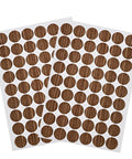 Slick Brown Screw Hole Cover Stickers 108 Piece Self Adhesive Round Caps laid out in sheets for cabinet and table decor.