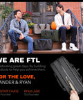 Two men sit on steps behind three 30L Hybrid Weekender Duffel With Garment Bag Shoe Compartment And 18 Inch Laptop Sleeve bags.
