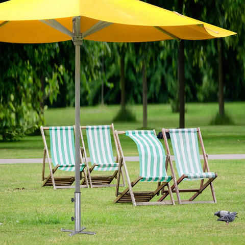 Removable Inground Umbrella Stand Anchor With Four Spikes Metal Ground Stake in lawn with umbrella and chairs
