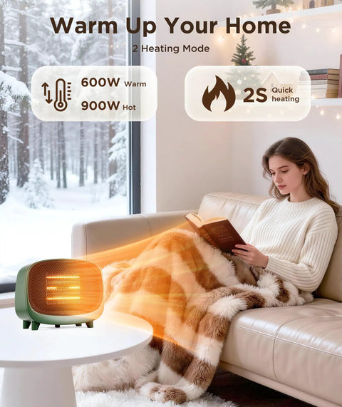 Keep You Toasty Anywhere With This Compact Tabletop 900W PTC Space Heater For Indoor Use on table near woman under blanket