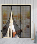 Heavy Duty Magnetic Screen Door With Self Sealing Magnets Hands Free Insect Shield For Patio And Bedroom Sliding Doors Up To 60 By 80 Inches Durable Fiberglass Mesh Black, screen hanging open in a living room scene.