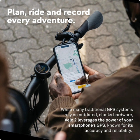 Cyclist using Velo 2 Bike GPS Computer With Wireless Global Navigation For Cycling Weatherproof Build on handlebars