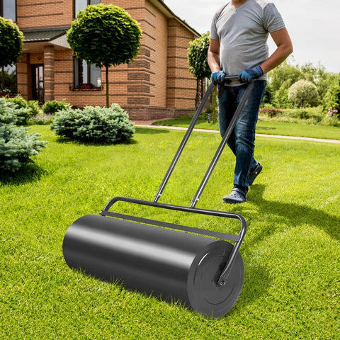 Man using Beefy 36 Inch Lawn Roller With 17 Gallon Capacity for Water or Sand Filling, visible on grass in yard.
