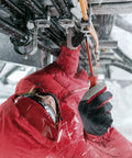 Person in red jacket using SwissGrip Slotted And Phillips Screwdriver Kit In Tobacco Brown, Heavy Duty Replacement Set outdoors.