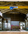 20X10FT Polyester Fabric Abandoned Industrial Warehouse Crane Graffiti Backdrop with urban decay elements in studio setup.