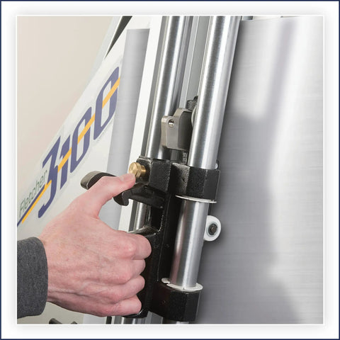 Close-up of hand adjusting the clamp on the Shop Grade Wall Mount Machine Cutter Rig for precise cutting.