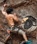 Climber with 25kN Auto Locking Carabiners 4 Pack UIAA Certified Heavy Duty D Shape attached, rock climbing setup.