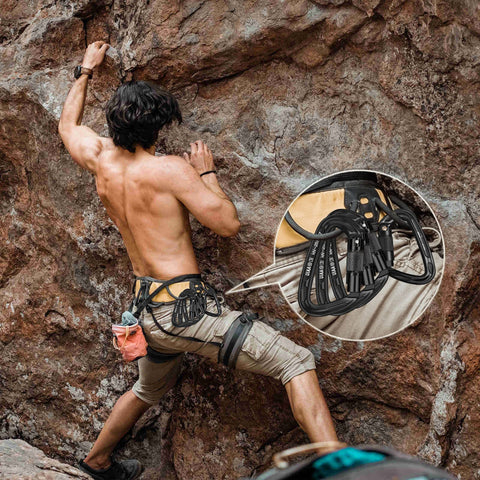 Climber with 25kN Auto Locking Carabiners 4 Pack UIAA Certified Heavy Duty D Shape attached, rock climbing setup.