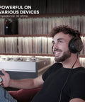 Person wearing DT 1990 Pro MKII Open-Back Wired Studio Headphones For Mixing And Mastering, 30 Ohm, black, in a lounge setting