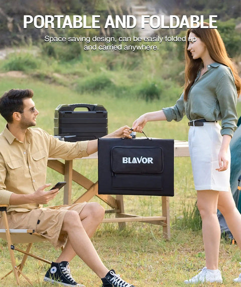 Two people outdoors holding a BLAVOR 120W Portable Solar Panel Charger With PD45W QC3.0 Fast Charge USB C And USB A Outputs