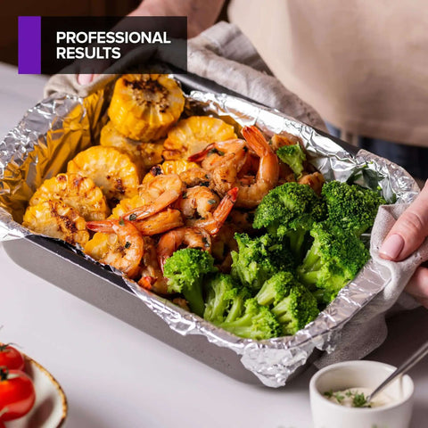 Tray lined with heavy duty aluminum foil sheets for deli use 100 count pop up 9 by 10 inch wrapping sheets, filled with grilled food