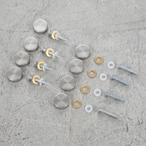 Heavy Duty Mirror Screw Caps With Stainless Steel Decorative Hardware, silver covers, and copper silicone washers on a grey surface.