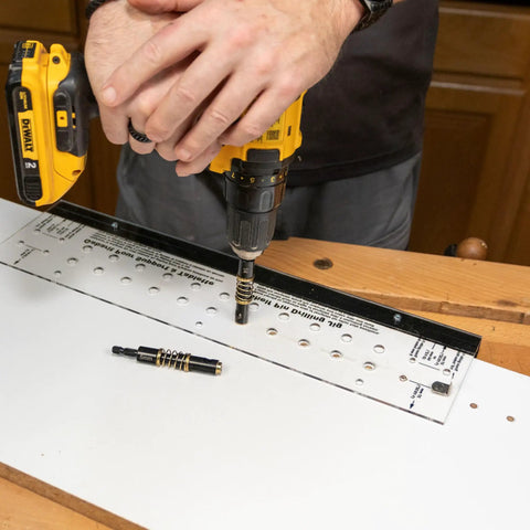 Beefy Shelf Pin Jig for adjustable shelves and cabinets, 19-inch aluminum spine with dual-row indexing and drill bits on wood surface.