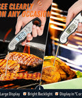 Waterproof Instant-Read Meat Thermometer With Backlight measuring temperature of grilled beef and roasted chicken