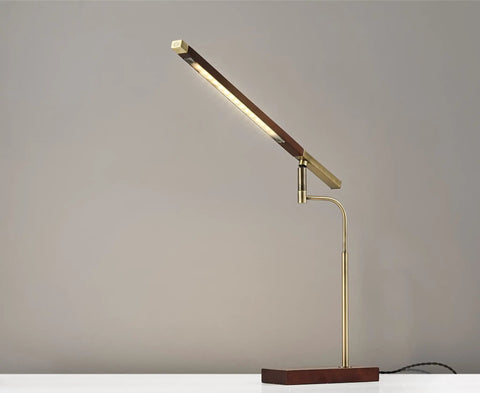 Barrett LED Desk Lamp With Dope Adjustable Walnut Wood Shade, 16.5 To 28.5 Inch Range, side view on white desk.
