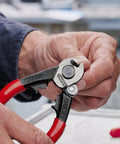 Close-up of hands using Heavy Duty Wire Rope Cutters 6 Millimeter Capacity With Opening Spring And Locking Lever Anti Fray Blade Geometry