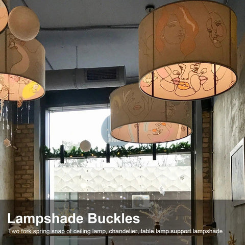 Close-up of modern art lampshades hanging from ceiling in a decorated room