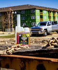 Top Shelf Diesel Fuel Additive And Daily Tune Up Formula Keeps Your Rig Running Slick Boosts Mileage And Sweeps Away Carbon Gunk For A Rock Solid Highway Cruise In A 16 Oz Bottle on a construction site.