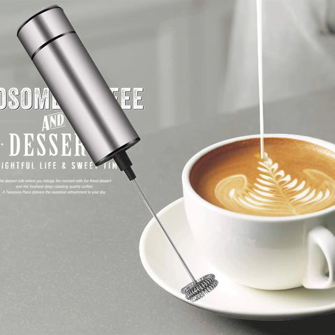 Handheld Battery Operated Milk Frother For Barista Quality Foam In Lattes And Cappuccinos, mini frappe mixer beside a latte