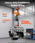 Heavy Duty 2200 Lbs Electric Chain Hoist With 10 Ft Lift, 120V Single Phase Motor, G100 Grade Steel Cable lifting an engine.